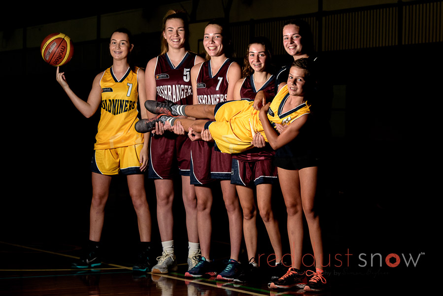 Girls representing Country Victoria in the under 16s competition at Wodonga Leisure Centre. Pictured: Izzy Delcour, Steph Gorman, Marney Gorman, Casey Arden. Carrying Wil Conway. Photo: Simon Bayliss